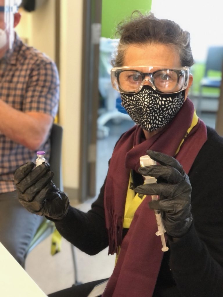 A nurse holds the COVID-19 vaccine