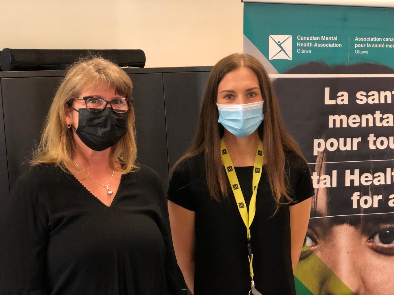 MPP Lucille Collard stands with IPAC nurse Ivana Vidjen, both masked