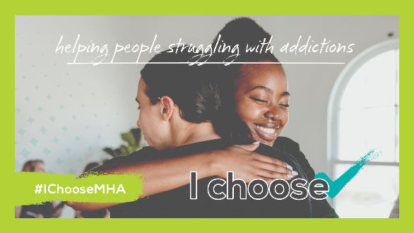 Two people, a white male and Black female, in a loving embrace. The female smiles.