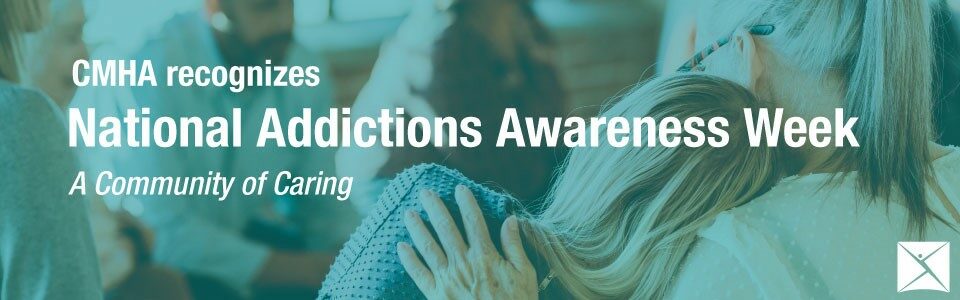 One person leans on another, photographed from behind; CMHA recognizes National Addictions Awareness Week